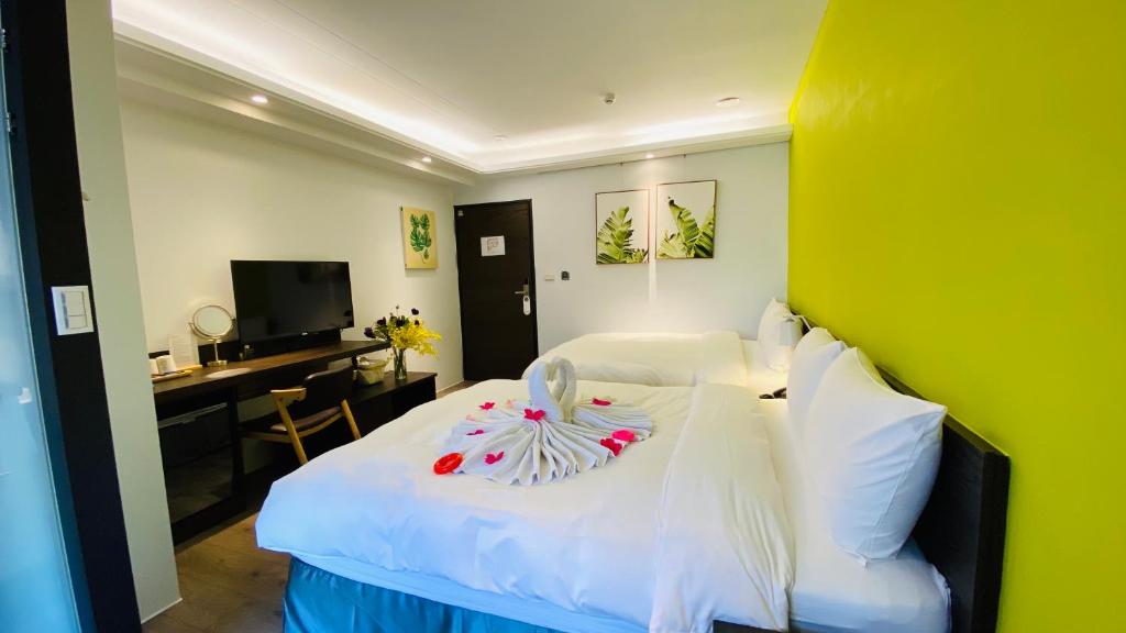 Posteľ alebo postele v izbe v ubytovaní Greenight Hotel