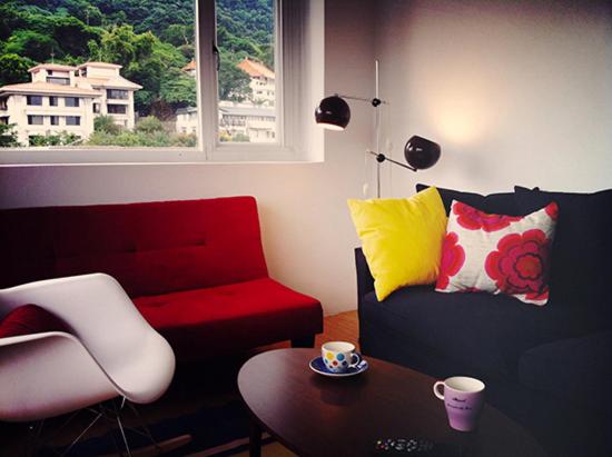 a living room with a couch and a table at Fun Taipei Share House 樂趣台北共居 in Taipei