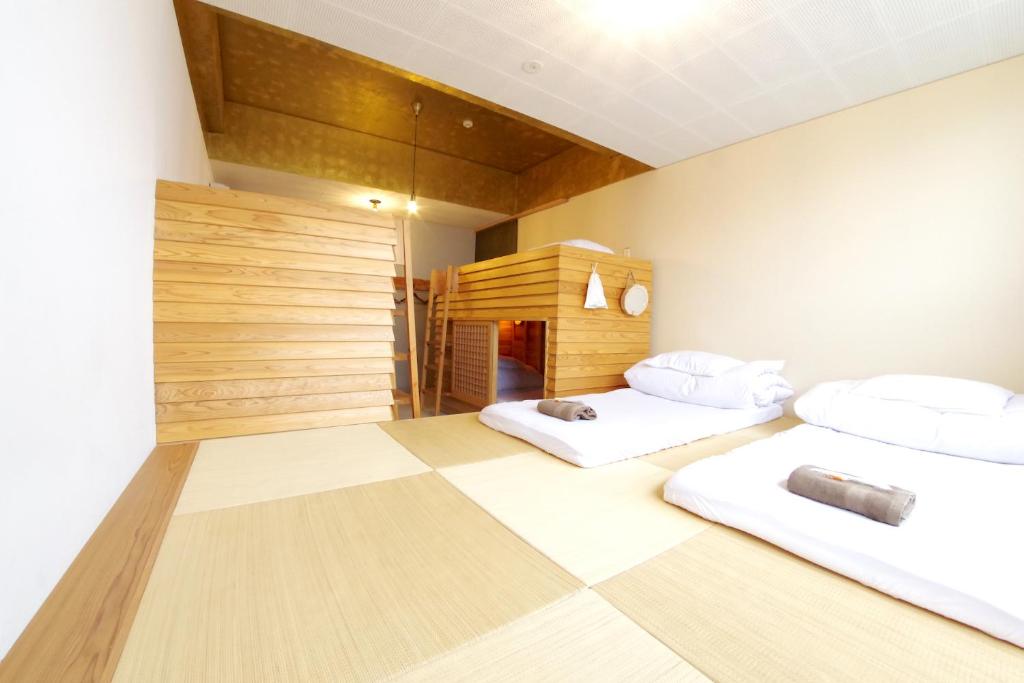 Postel nebo postele na pokoji v ubytování Hostel 1889