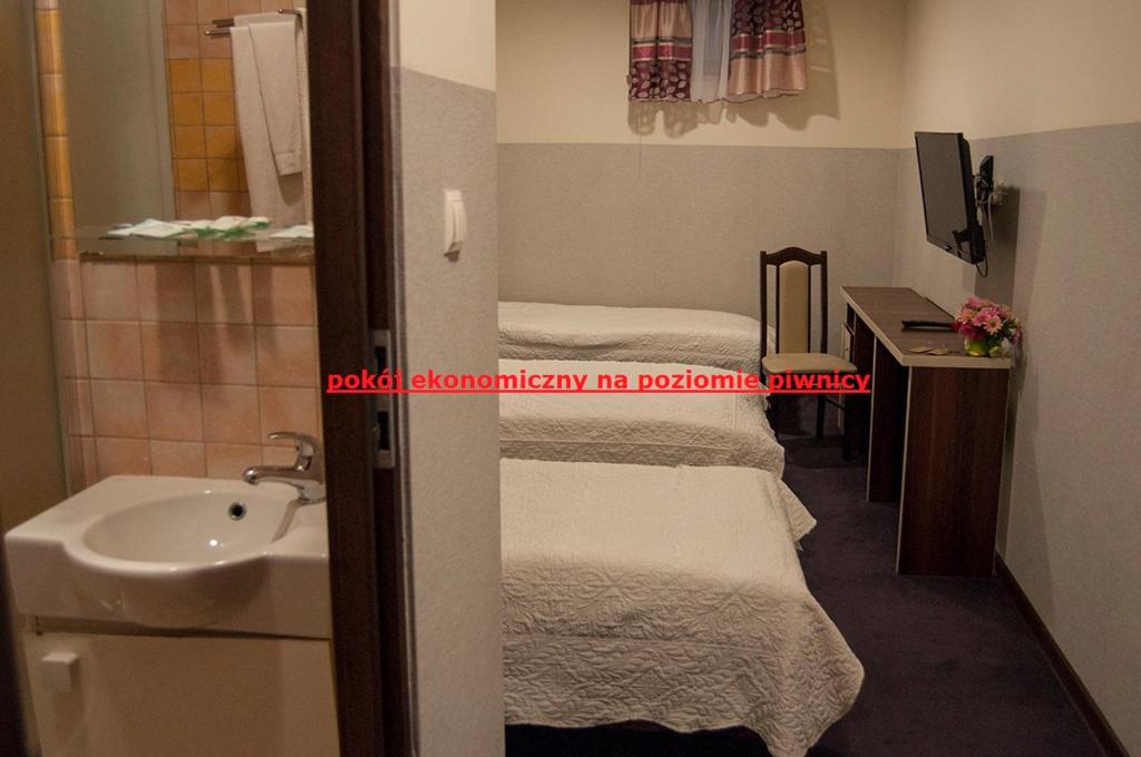 Postel nebo postele na pokoji v ubytování Prymus