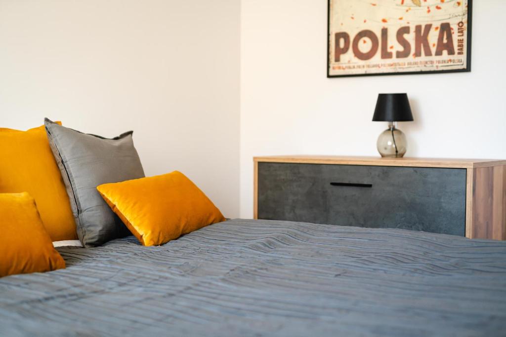 Posteľ alebo postele v izbe v ubytovaní Apartamenty Wczasowa