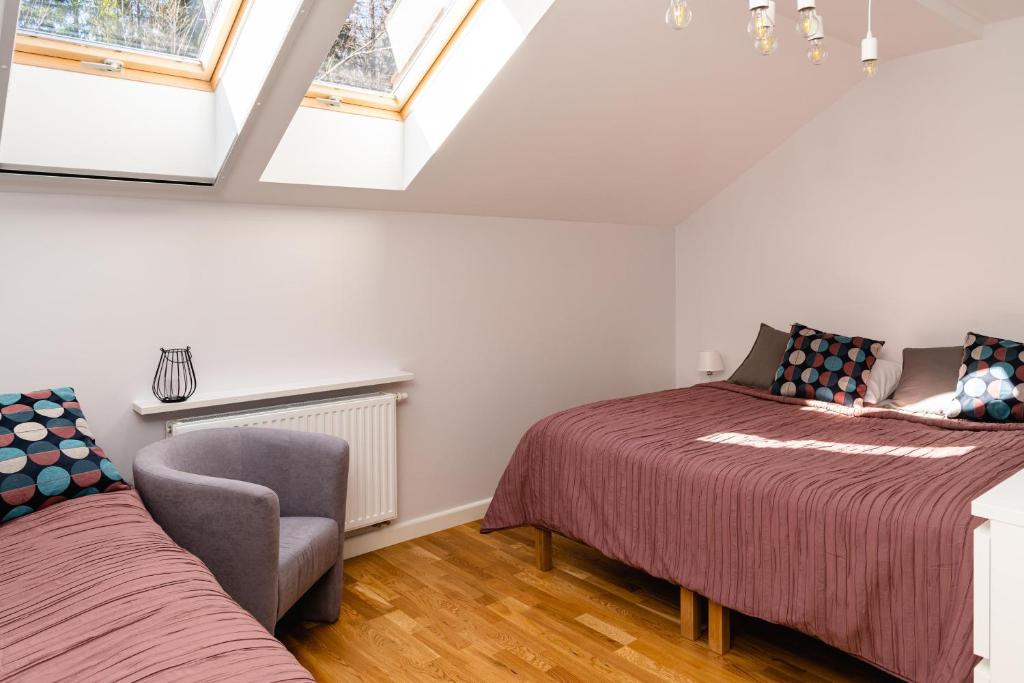 Posteľ alebo postele v izbe v ubytovaní Apartamenty Wczasowa