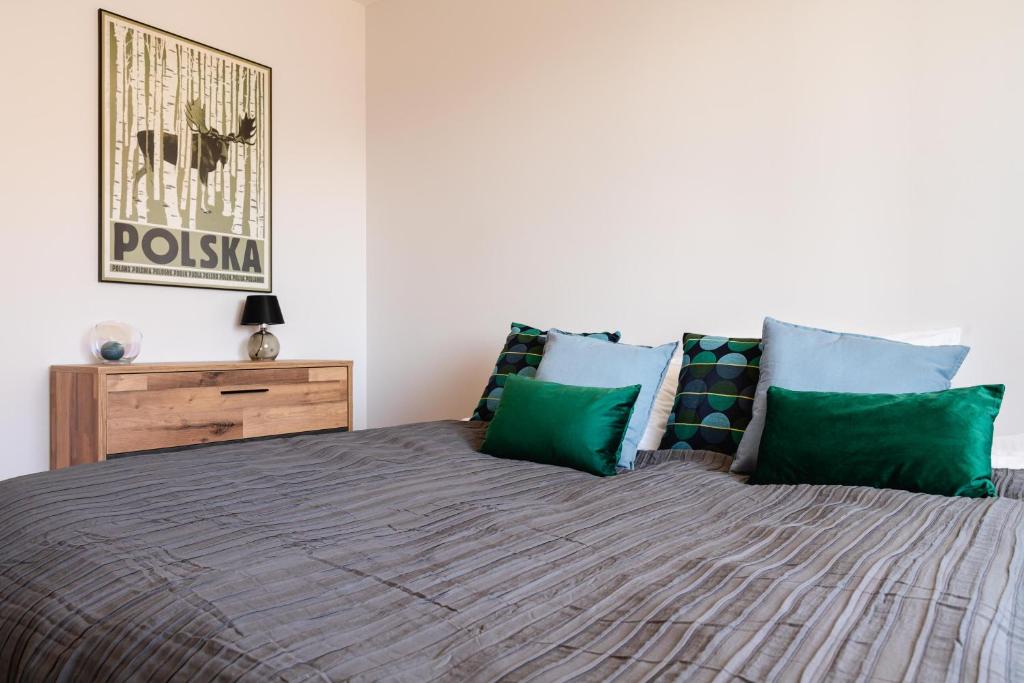 Posteľ alebo postele v izbe v ubytovaní Apartamenty Wczasowa