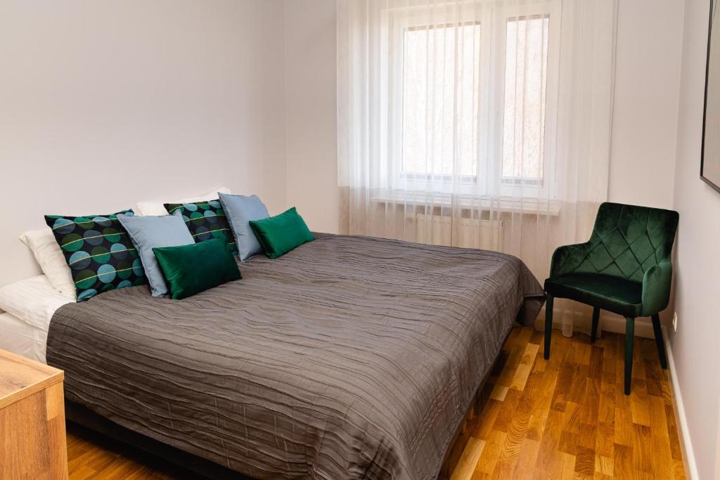 Posteľ alebo postele v izbe v ubytovaní Apartamenty Wczasowa