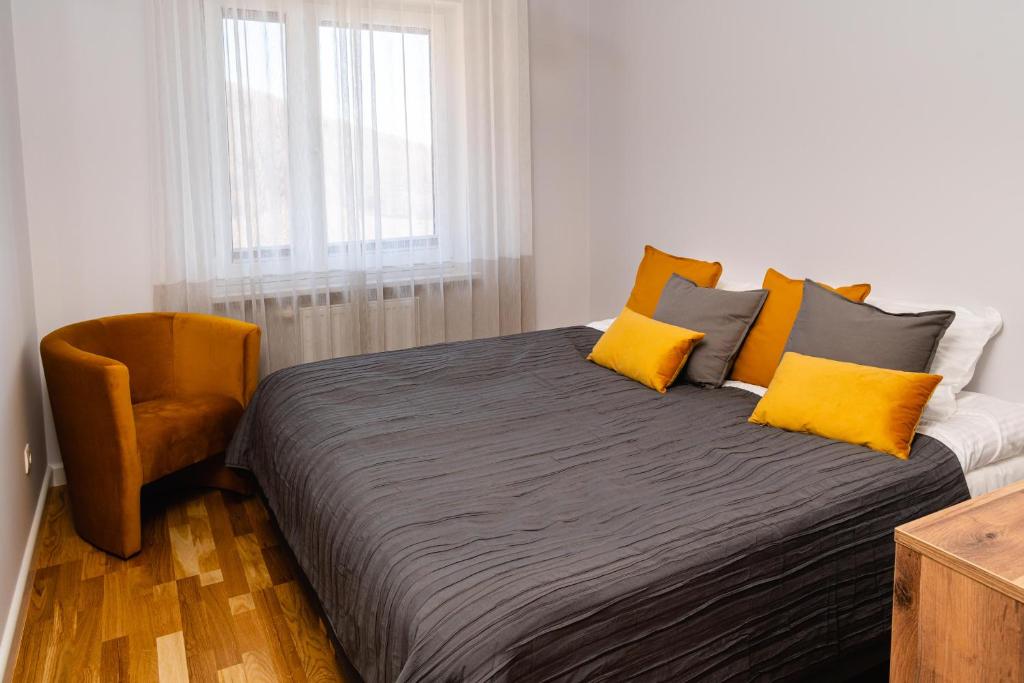 Posteľ alebo postele v izbe v ubytovaní Apartamenty Wczasowa