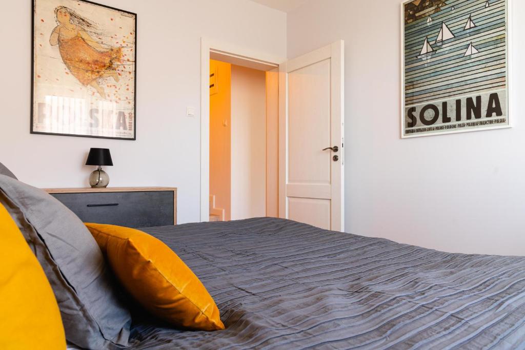 Posteľ alebo postele v izbe v ubytovaní Apartamenty Wczasowa