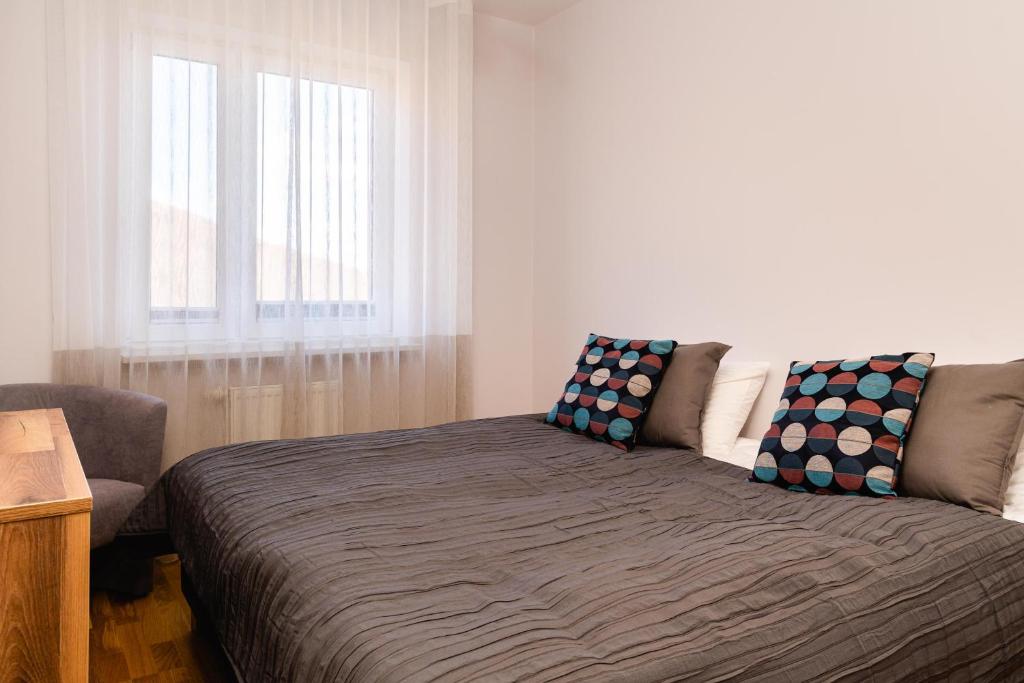 Posteľ alebo postele v izbe v ubytovaní Apartamenty Wczasowa