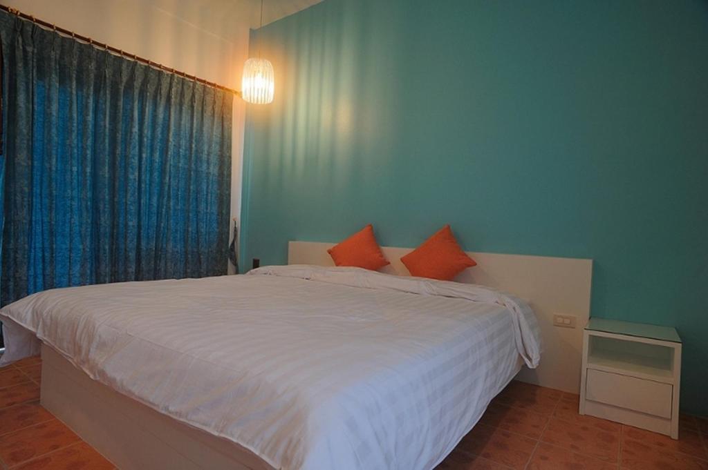 Postel nebo postele na pokoji v ubytování Clear House Phuket