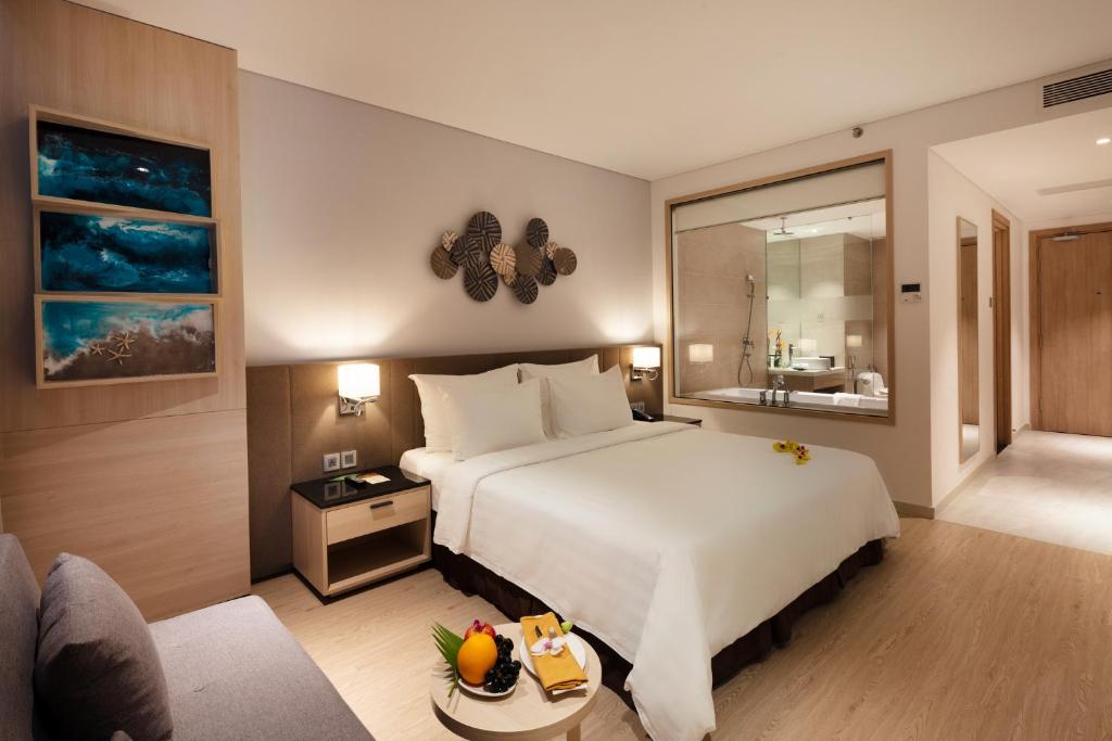 Postel nebo postele na pokoji v ubytování DQua Hotel