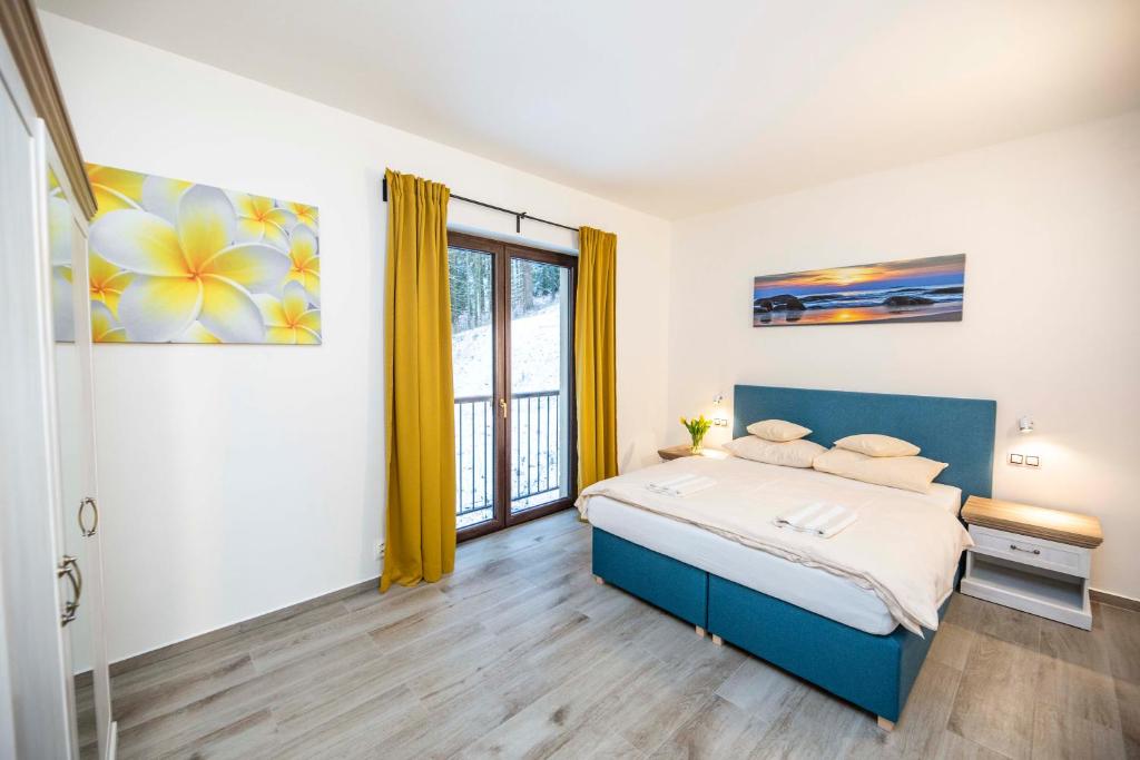 Postel nebo postele na pokoji v ubytování Spa & Wellness Hotel St. Moritz
