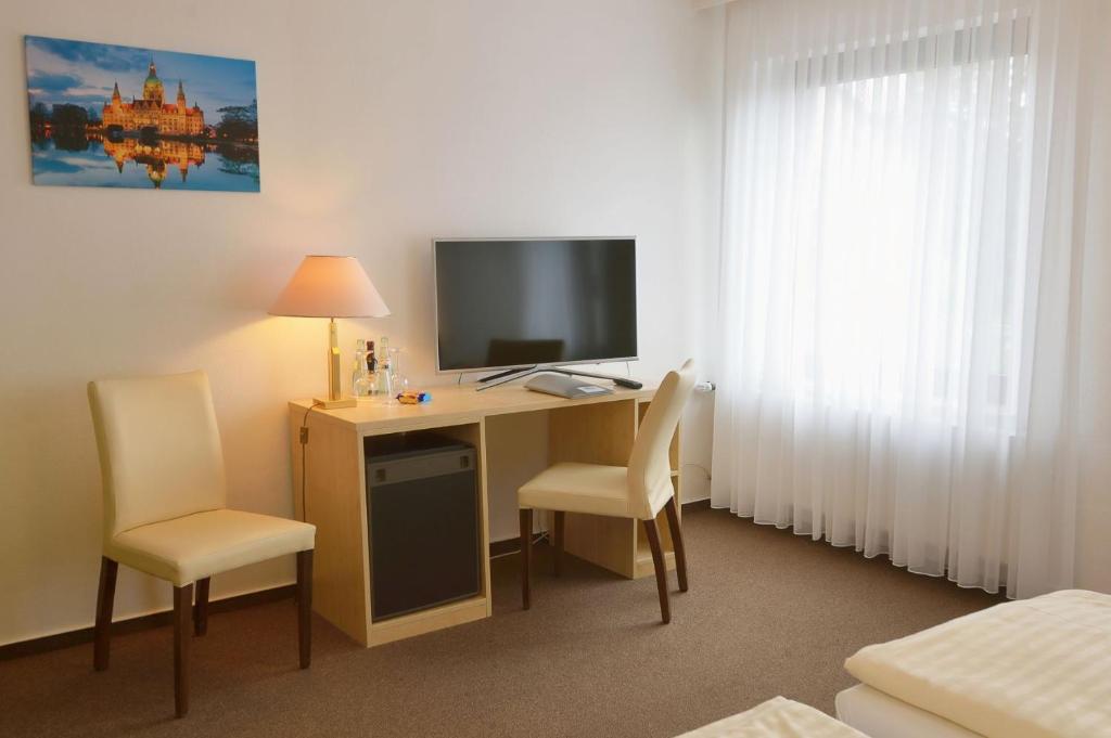 TV a/nebo společenská místnost v ubytování Hotel Bertram