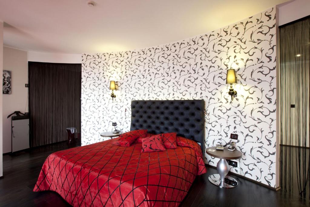 Postel nebo postele na pokoji v ubytování Palace Hotel Moderno