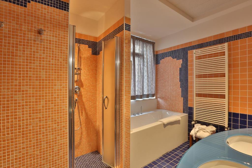 Postel nebo postele na pokoji v ubytování Palace Hotel Moderno