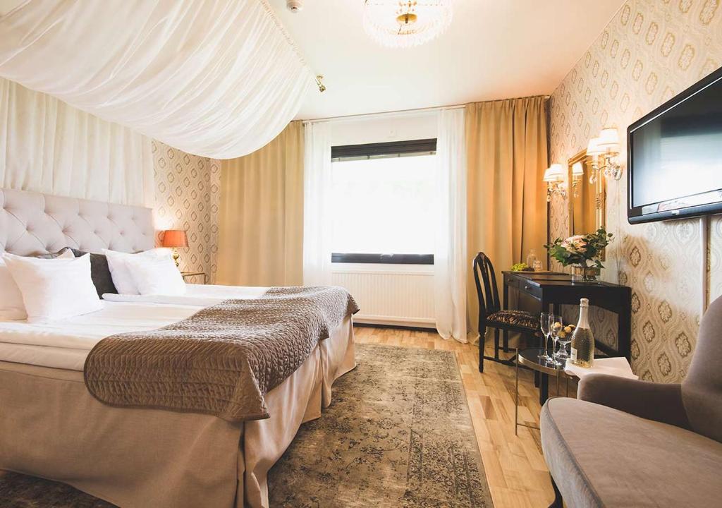 Postel nebo postele na pokoji v ubytování Hotel Bellevue