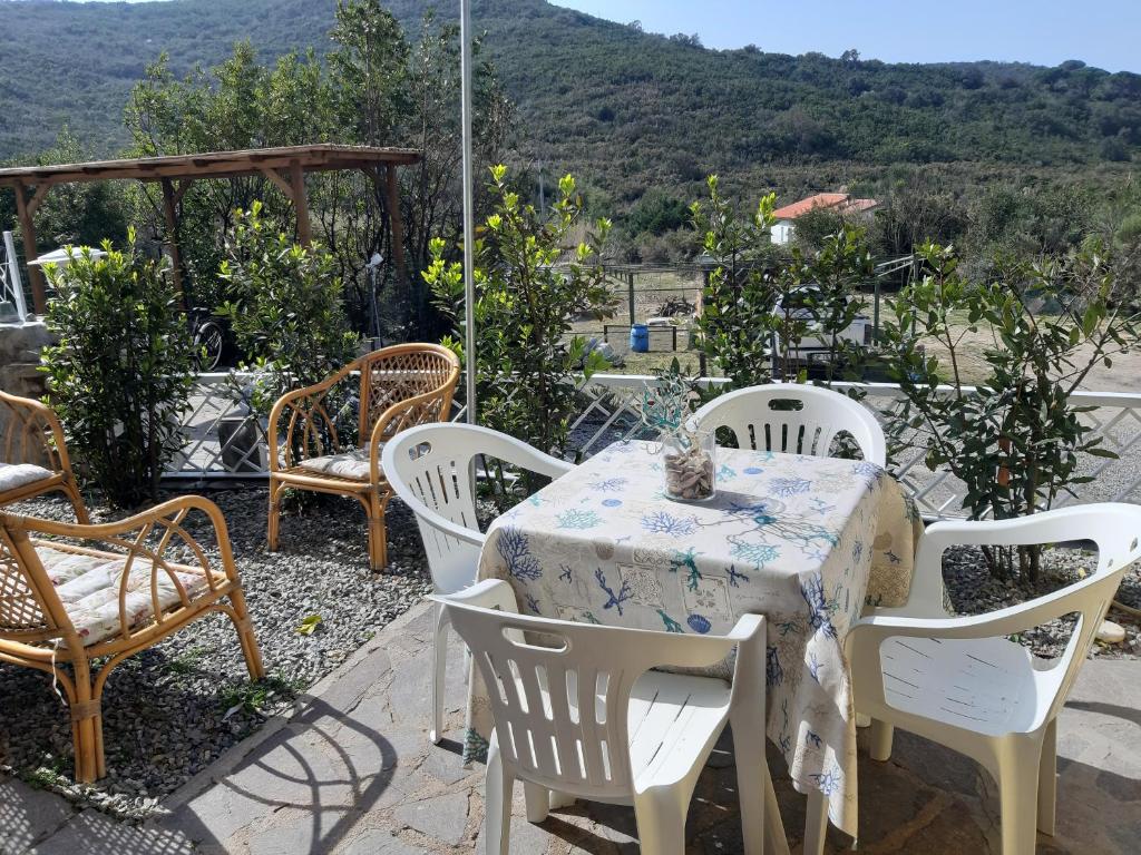 a table and chairs on a patio with a view at Casa Vacanza Paradise 1 in Marina di Campo