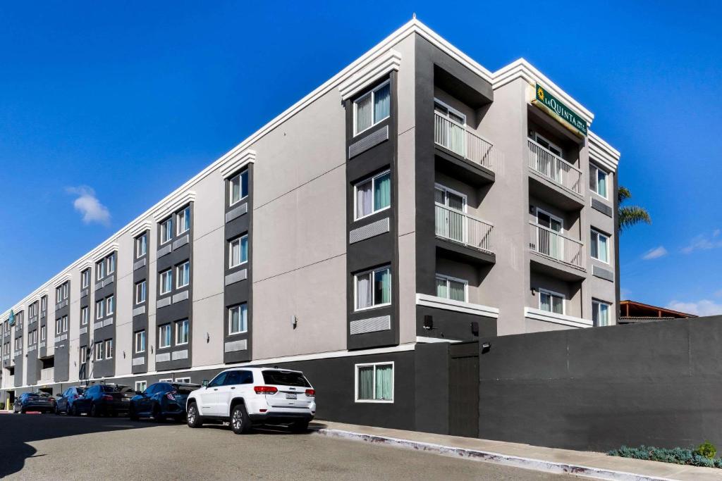 a white car parked in front of a building at La Quinta by Wyndham San Diego Mission Bay in San Diego