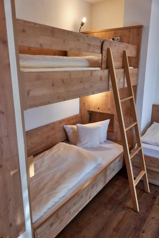 Postel nebo postele na pokoji v ubytování Hotel Engel - Familotel Hochschwarzwald