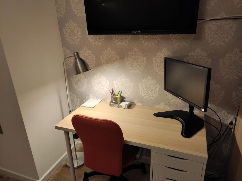 Televízia a/alebo spoločenská miestnosť v ubytovaní Pietrzak Apartments