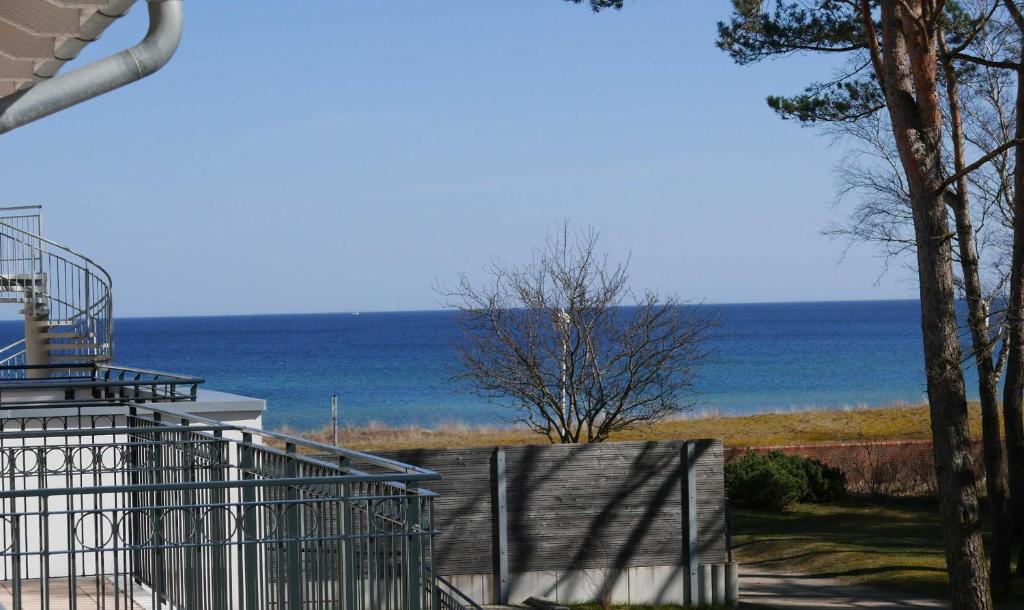 a view of the ocean from the balcony of a house at Baabe Inselparadies Fewo Arkona Re in Baabe