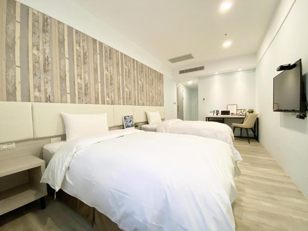Postel nebo postele na pokoji v ubytování Fengjia JinRui Hotel