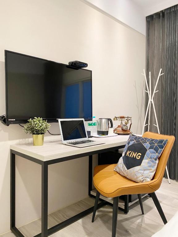 TV a/nebo společenská místnost v ubytování Fengjia JinRui Hotel