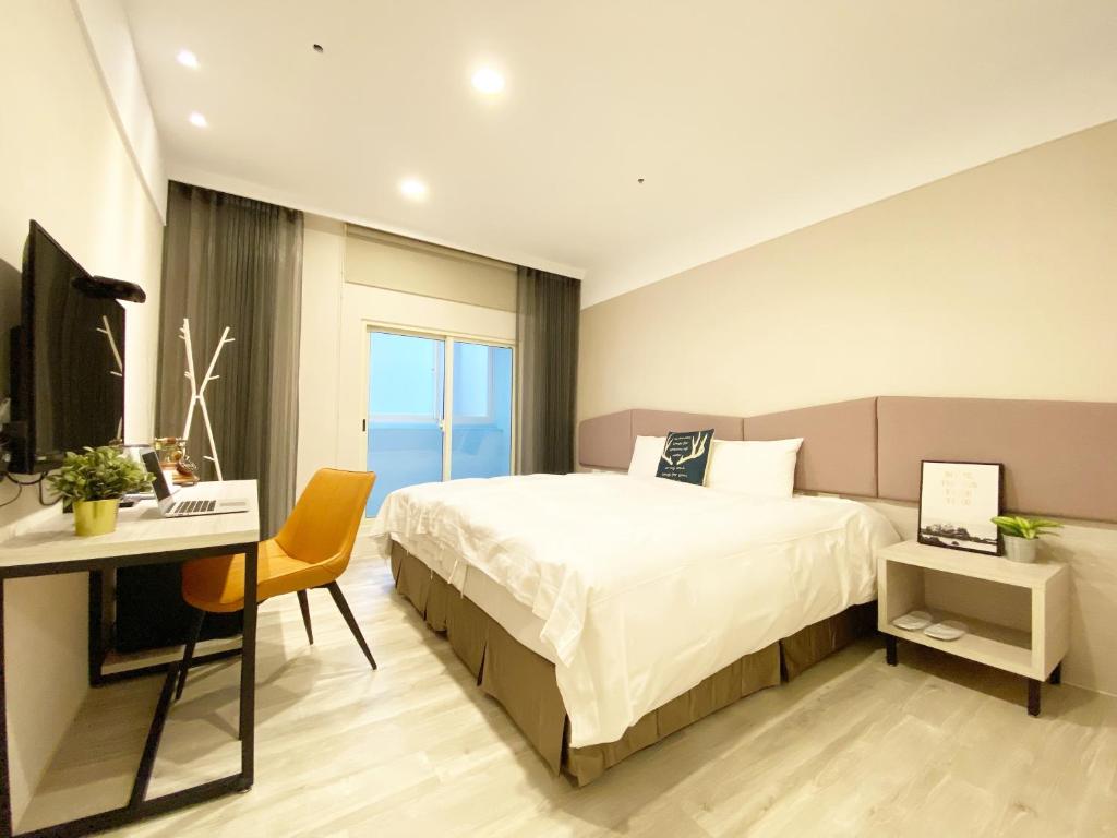 Postel nebo postele na pokoji v ubytování Fengjia JinRui Hotel