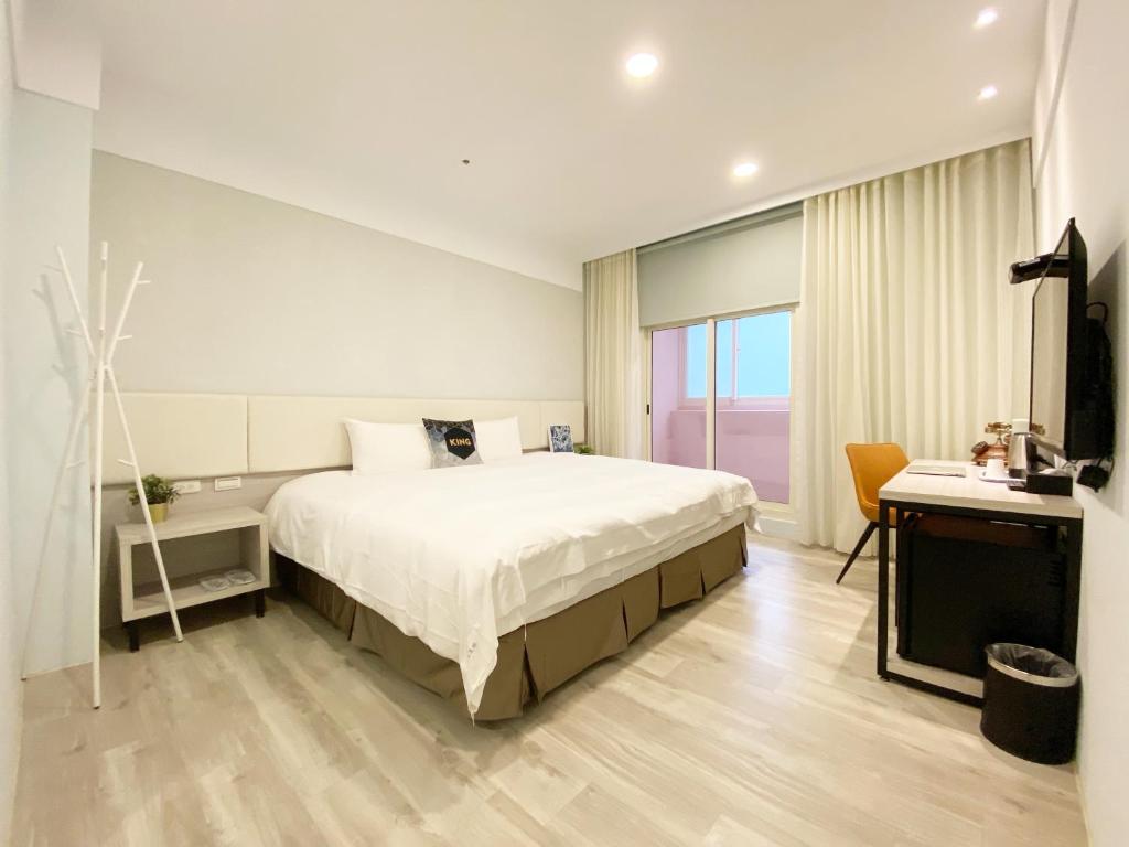 Postel nebo postele na pokoji v ubytování Fengjia JinRui Hotel