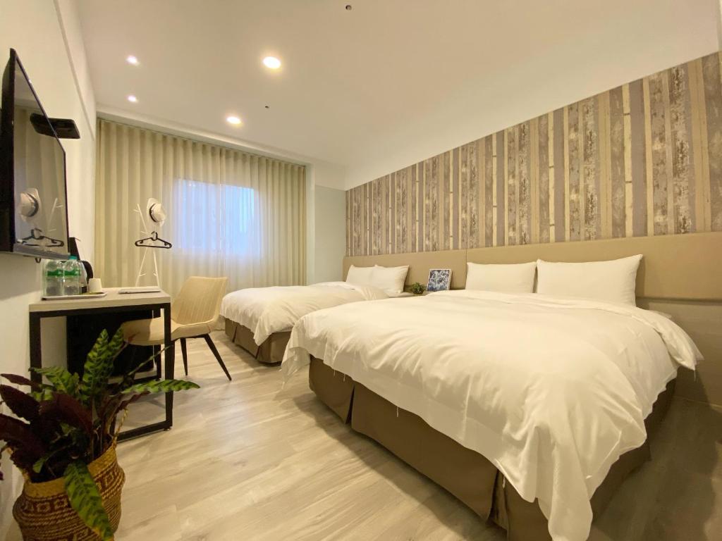Postel nebo postele na pokoji v ubytování Fengjia JinRui Hotel