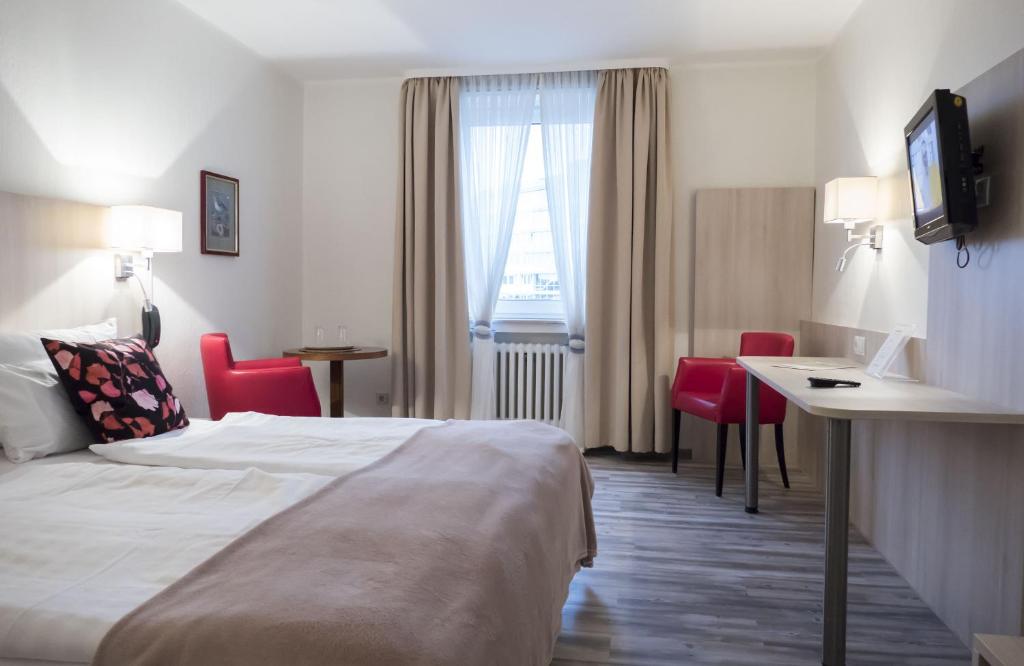 Postel nebo postele na pokoji v ubytování Hotel Excelsior