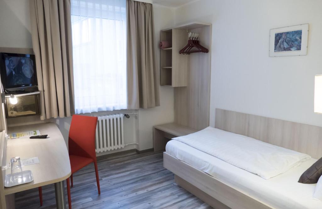 Postel nebo postele na pokoji v ubytování Hotel Excelsior
