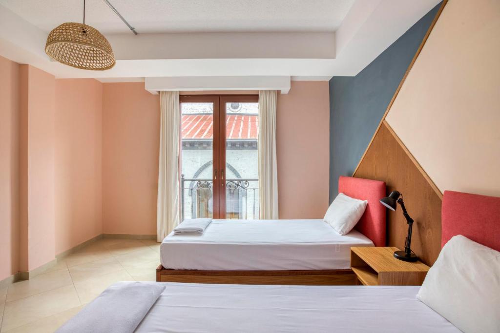 Postel nebo postele na pokoji v ubytování Hotel Brio Centro