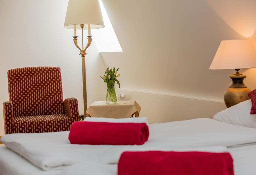 Postel nebo postele na pokoji v ubytování Hotel Koliba