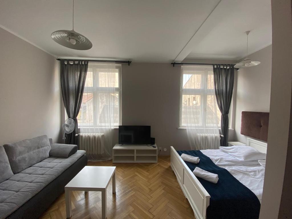 Posteľ alebo postele v izbe v ubytovaní P&J Apartamenty Św. Krzyża