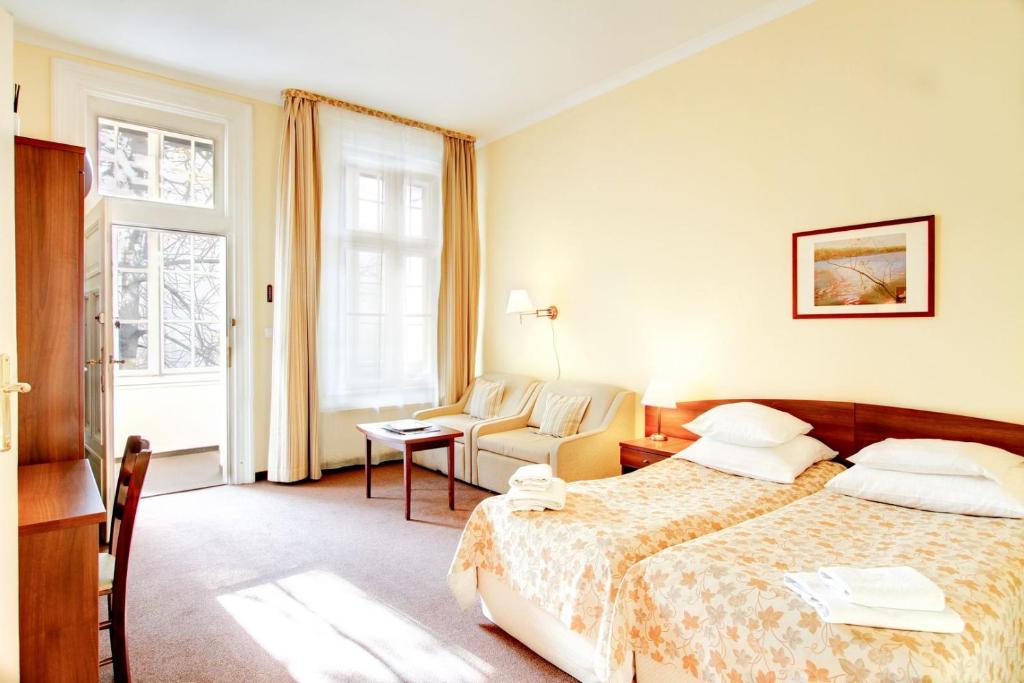 Posteľ alebo postele v izbe v ubytovaní P&J Apartamenty Św. Krzyża