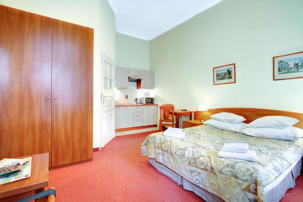 Posteľ alebo postele v izbe v ubytovaní P&J Apartamenty Św. Krzyża