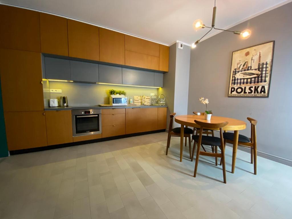 Kuchyň nebo kuchyňský kout v ubytování P&J Apartments Lubicz