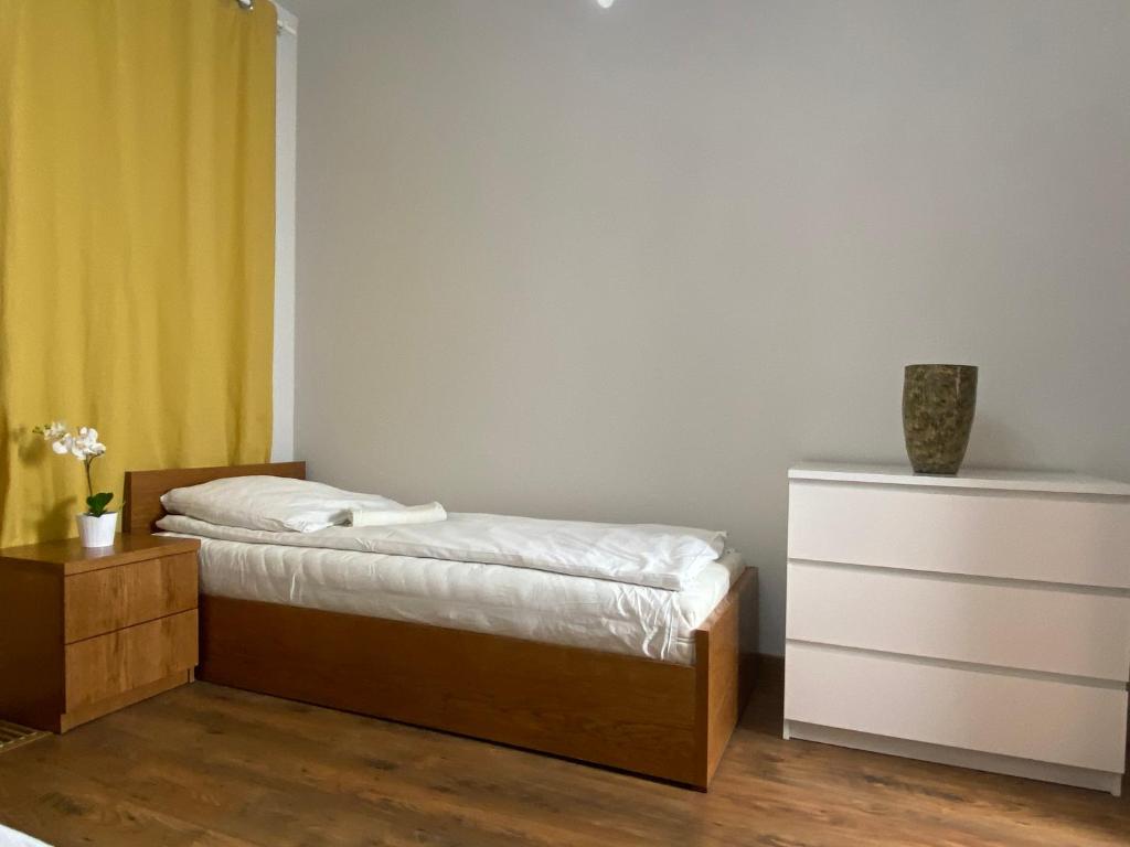 Postel nebo postele na pokoji v ubytování P&J Apartments Lubicz