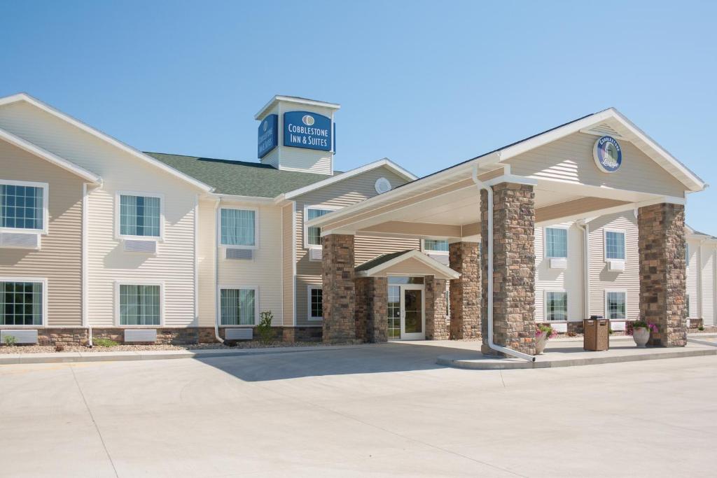 a building with a sign on top of it at Cobblestone Inn & Suites - Brookville in Brookville