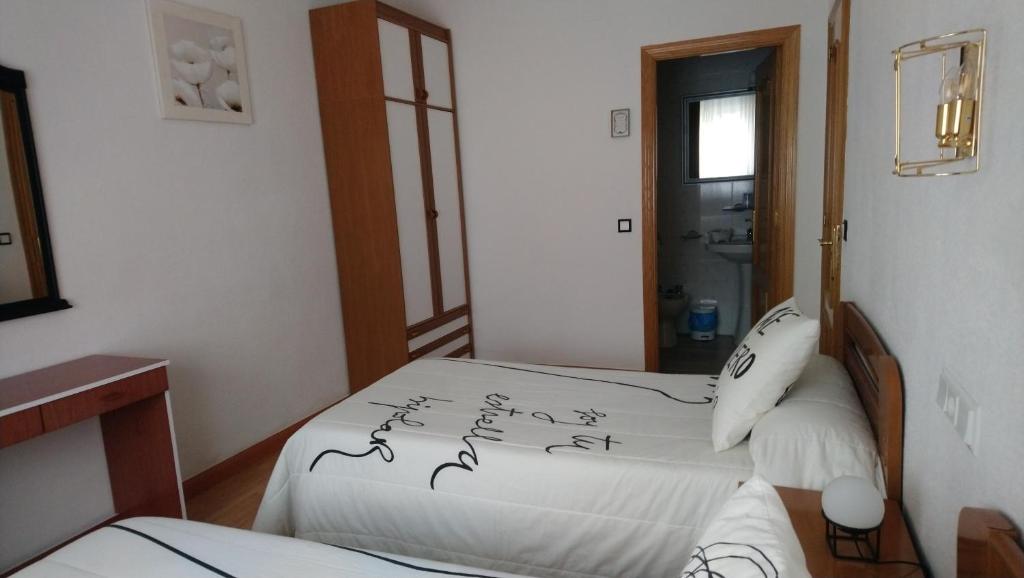 Postel nebo postele na pokoji v ubytování Hostal "Los Chanos el Ruso"