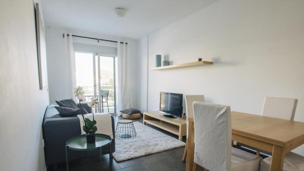 Coin salon dans l'établissement Cornisa Apartments