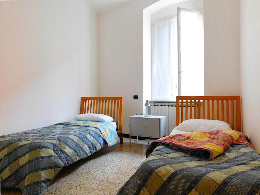 A bed or beds in a room at Welcome to alma's house, Levanto