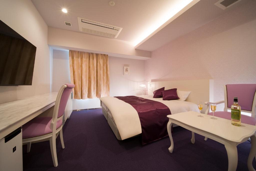 Postel nebo postele na pokoji v ubytování HOTEL LASCALA