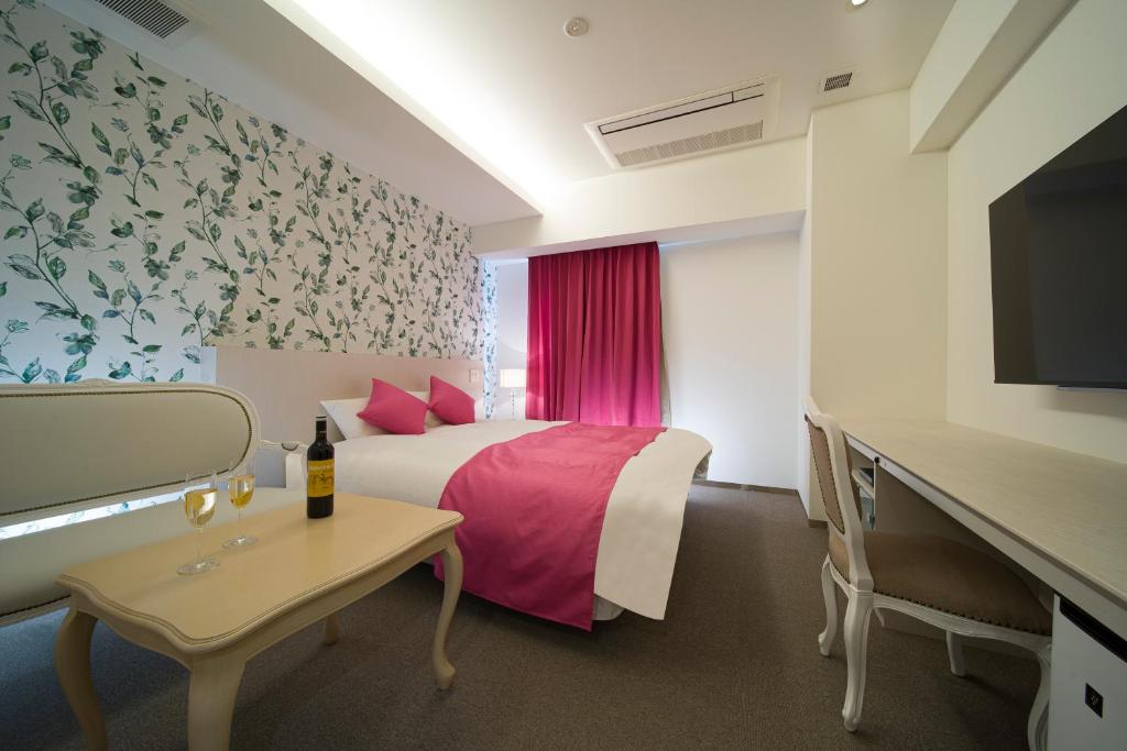 Postel nebo postele na pokoji v ubytování HOTEL LASCALA