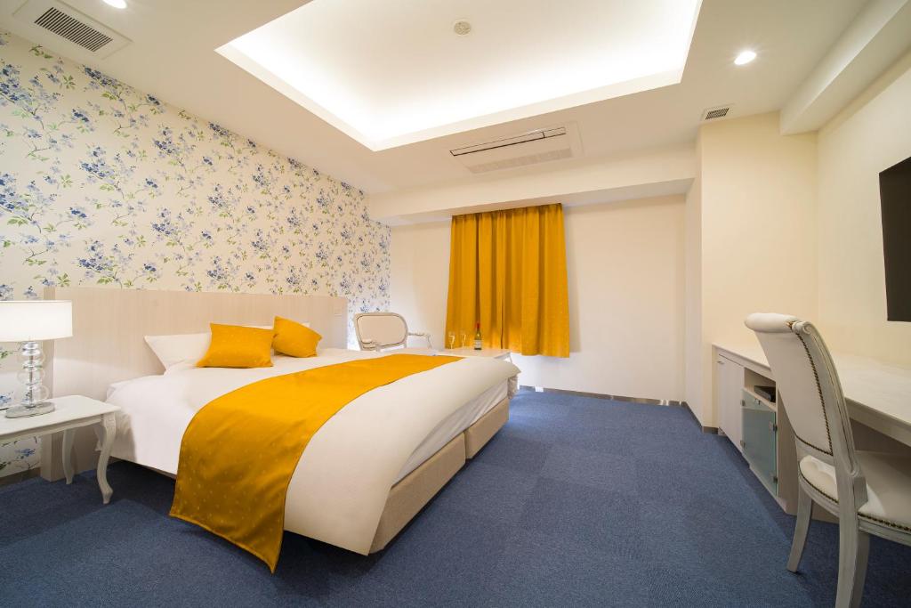 Postel nebo postele na pokoji v ubytování HOTEL LASCALA