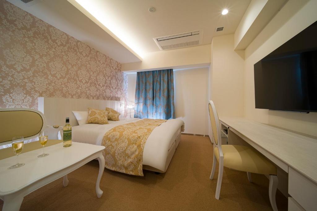 TV a/nebo společenská místnost v ubytování HOTEL LASCALA