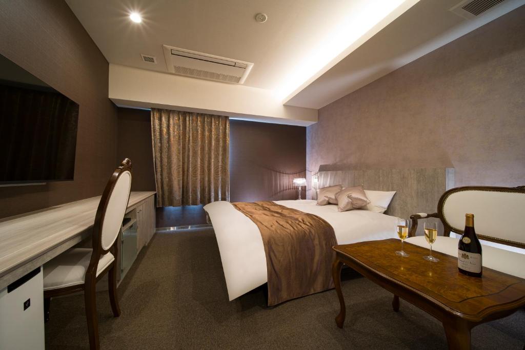 Postel nebo postele na pokoji v ubytování HOTEL LASCALA