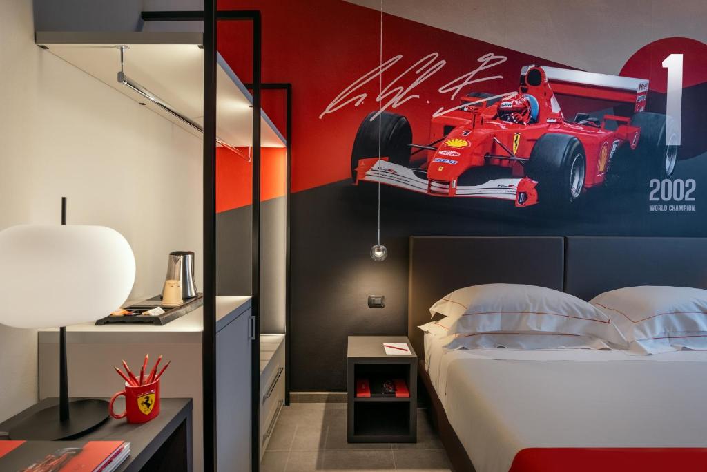 Postel nebo postele na pokoji v ubytování Hotel Maranello Village