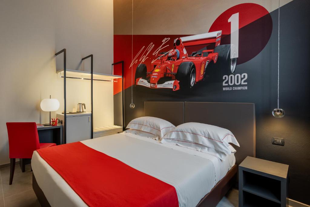 Postel nebo postele na pokoji v ubytování Hotel Maranello Village