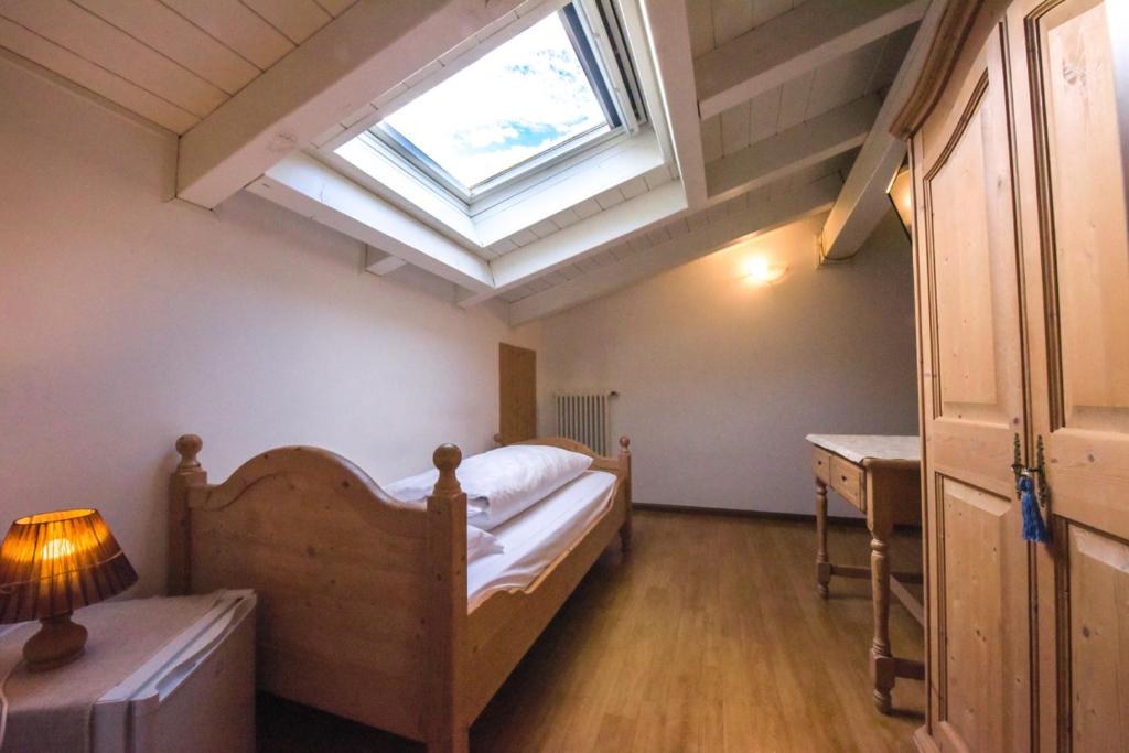 Postel nebo postele na pokoji v ubytování Agriturismo Salizzoni