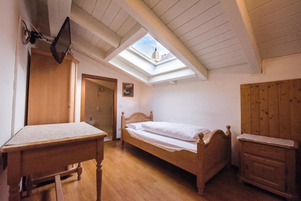 Postel nebo postele na pokoji v ubytování Agriturismo Salizzoni